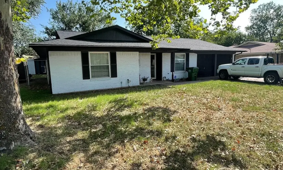 Professional roofing crew working on a residential roof in Thompson